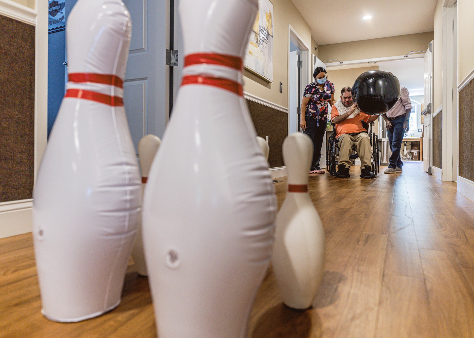 Image of man in wheelchair bowling