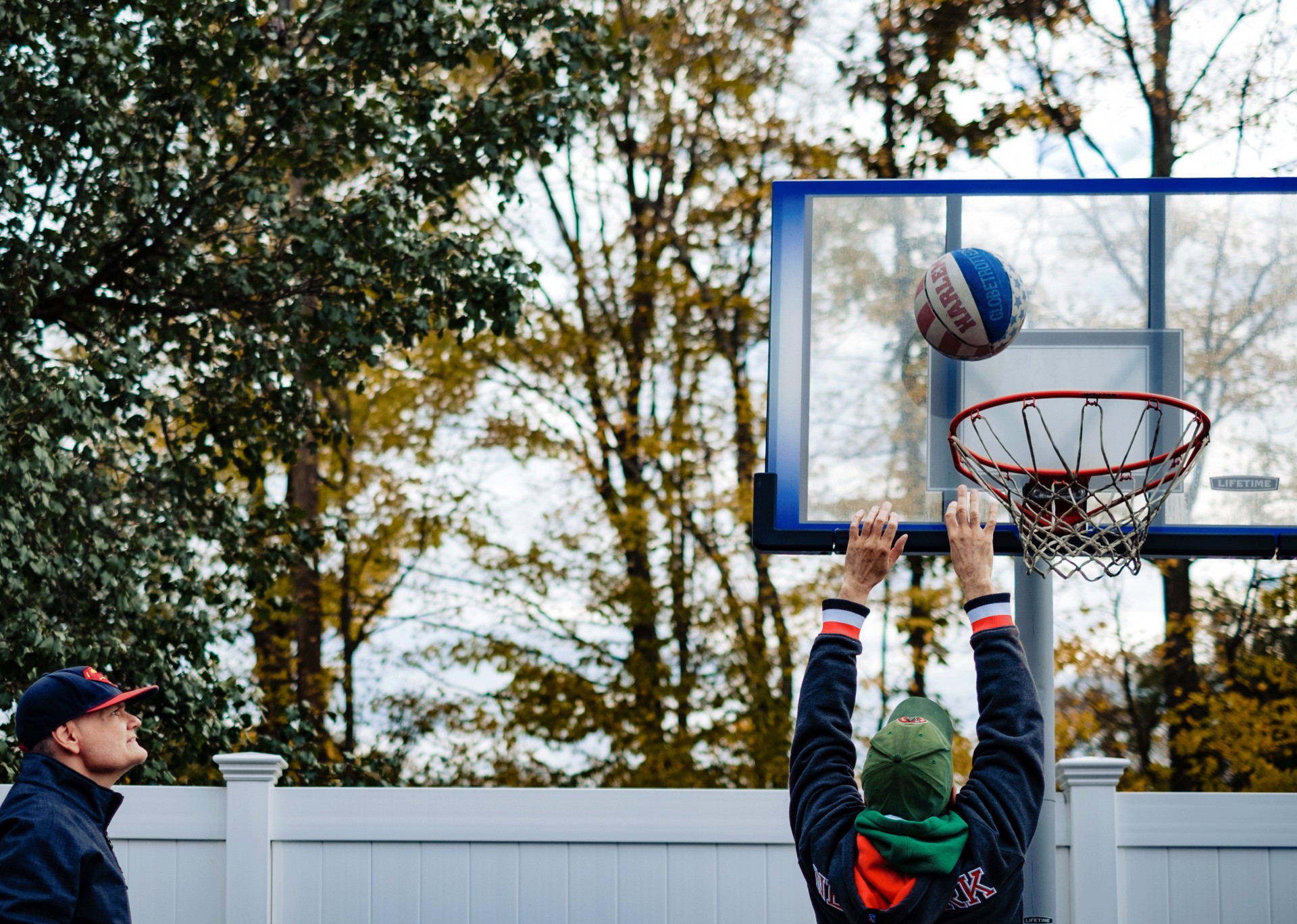 Image of two men playing basketball